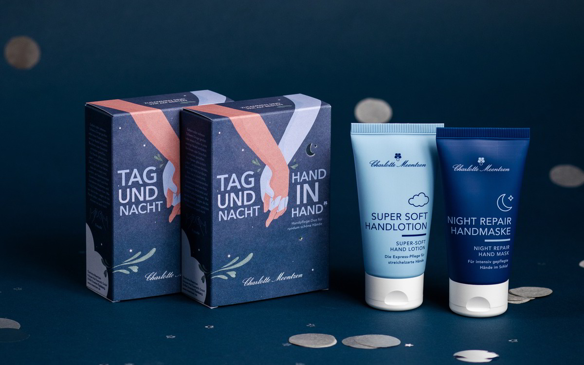 Zwei Handpflegeprodukte in stilvollen Verpackungen, mit dem Thema „Tag und Nacht“, auf einem blauen Hintergrund.