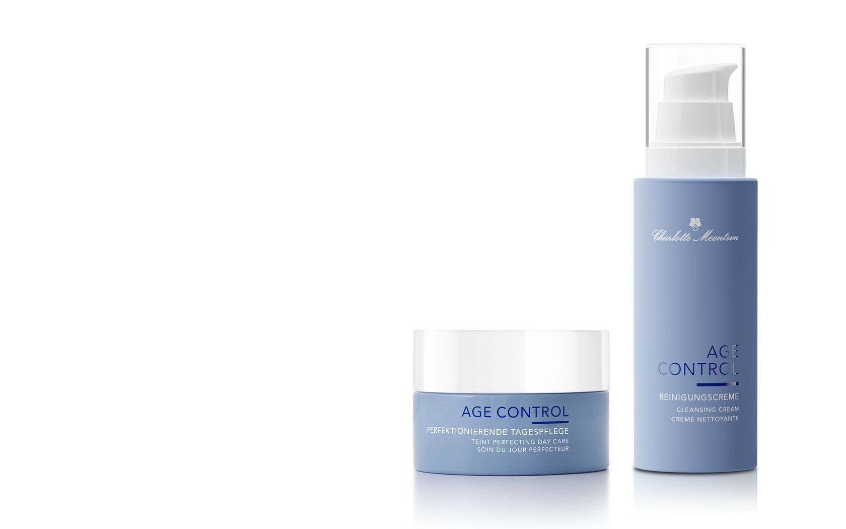 Zwei Hautpflegeprodukte in blauen Verpackungen: eine Tagescreme und eine Reinigungscreme.